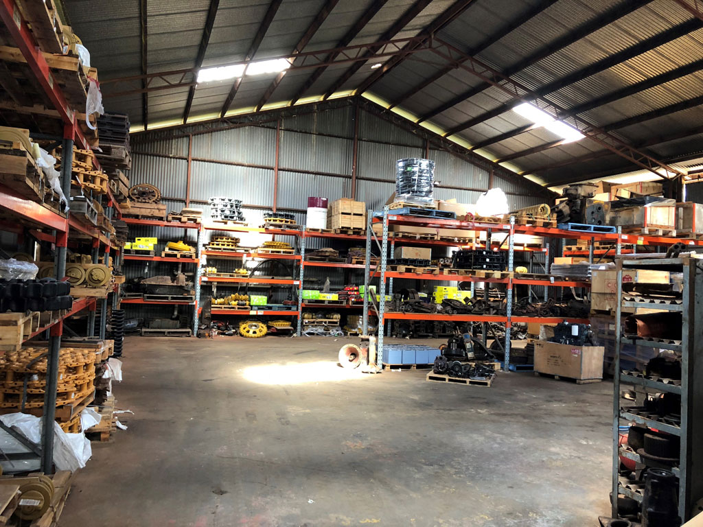 South Burnett Tractor Parts warehouse interior showing floor-to-ceiling racking stocked with parts