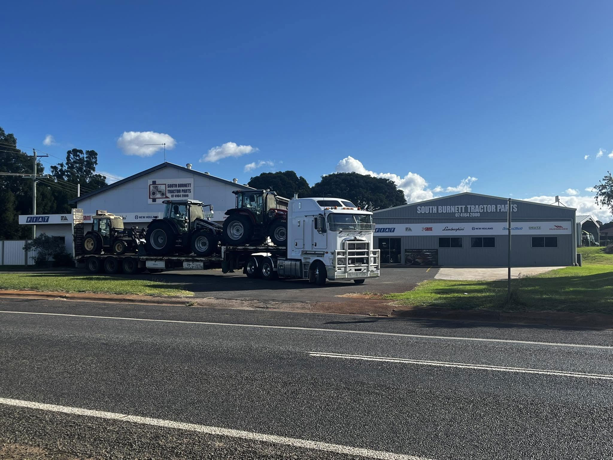 South Burnett Tractor Parts premises in Wooroolin with semi-trailer delivering tractors
